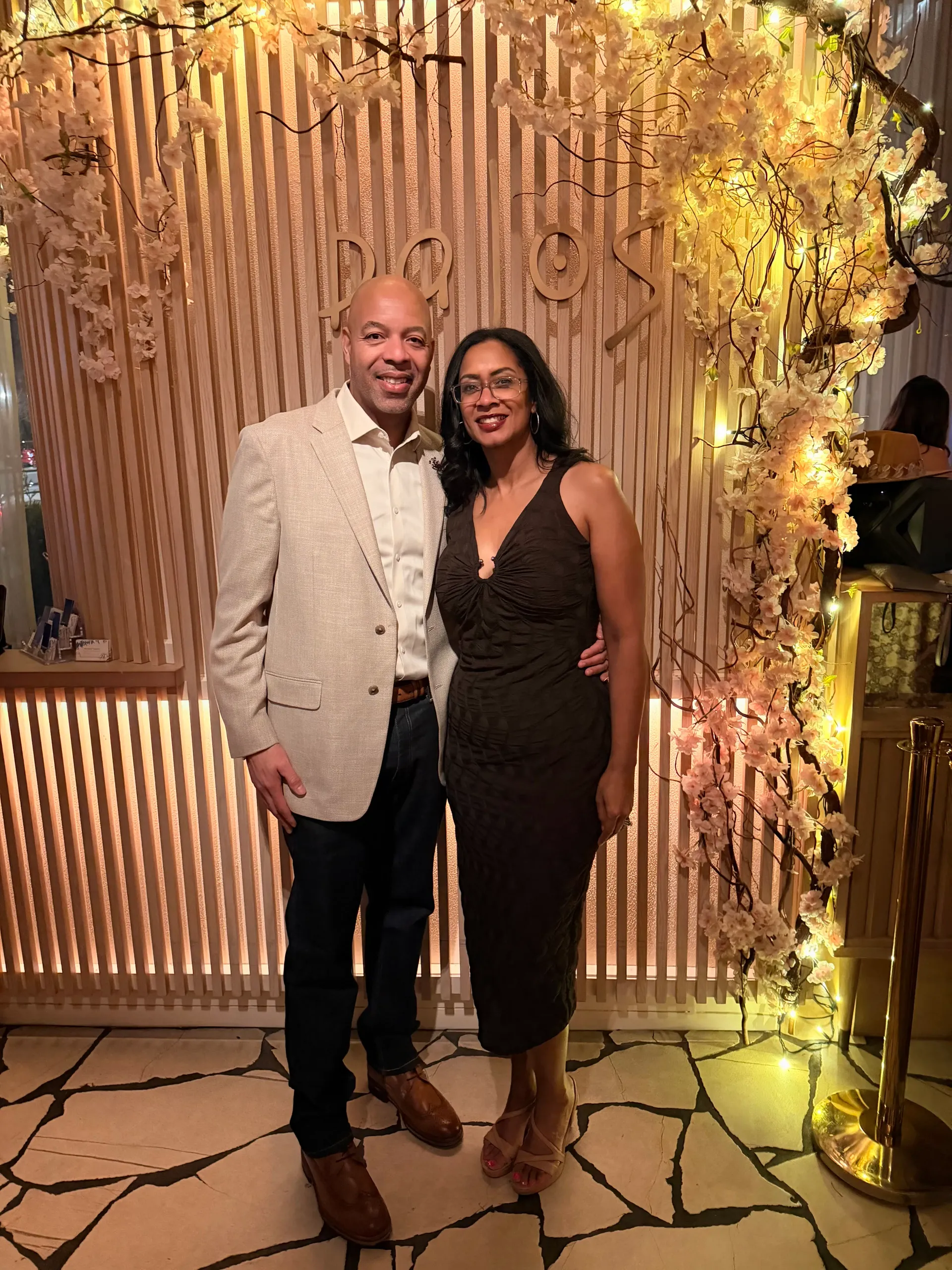 KC and Nat smiling together in evening attire