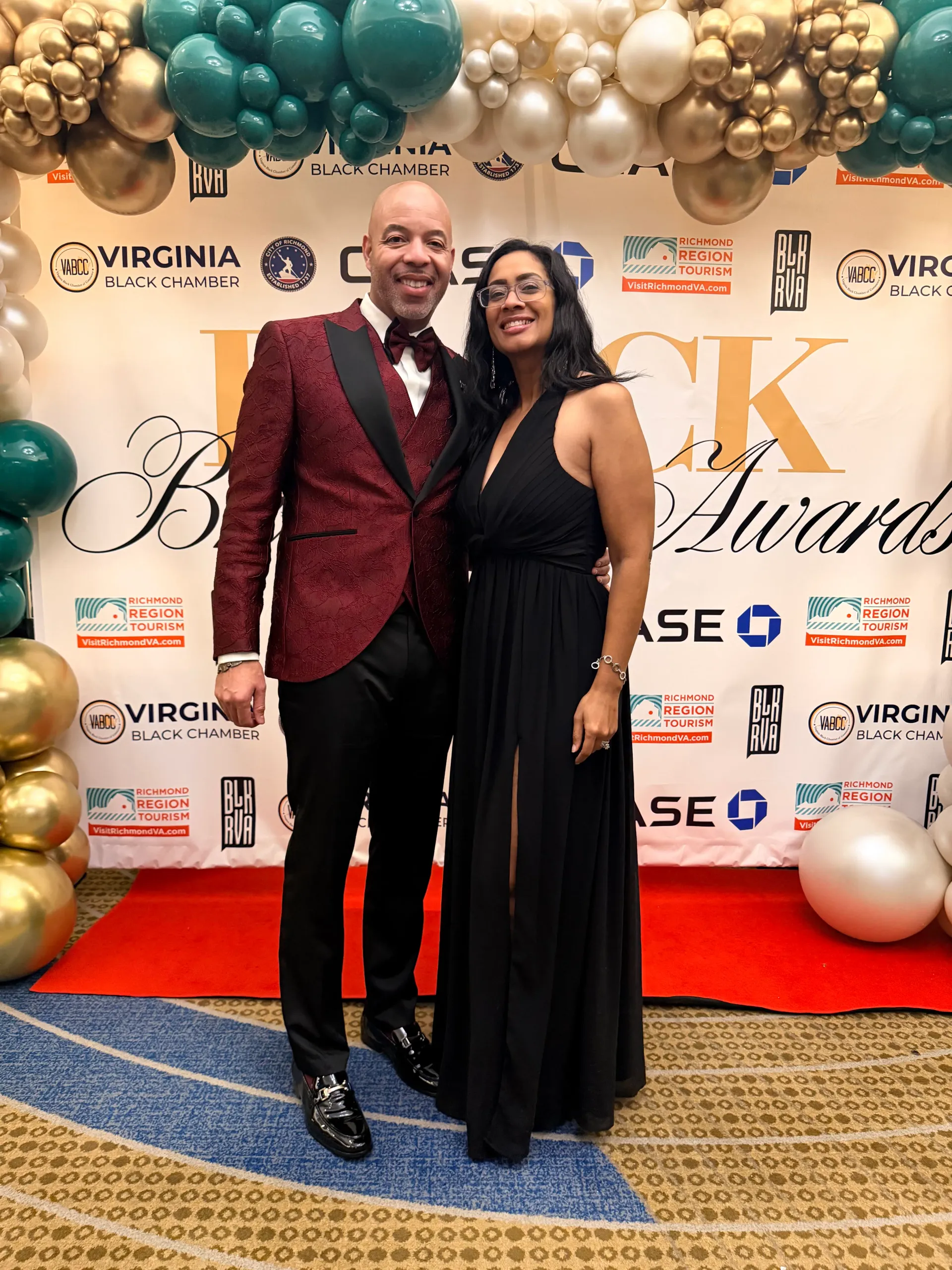 KC and Nat dressed together on a red carpet